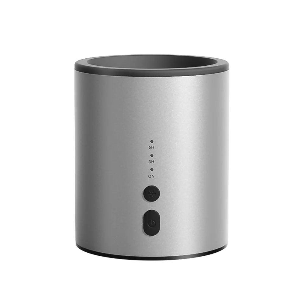 A silver electric wax melt heater with a dark gray top and control buttons.