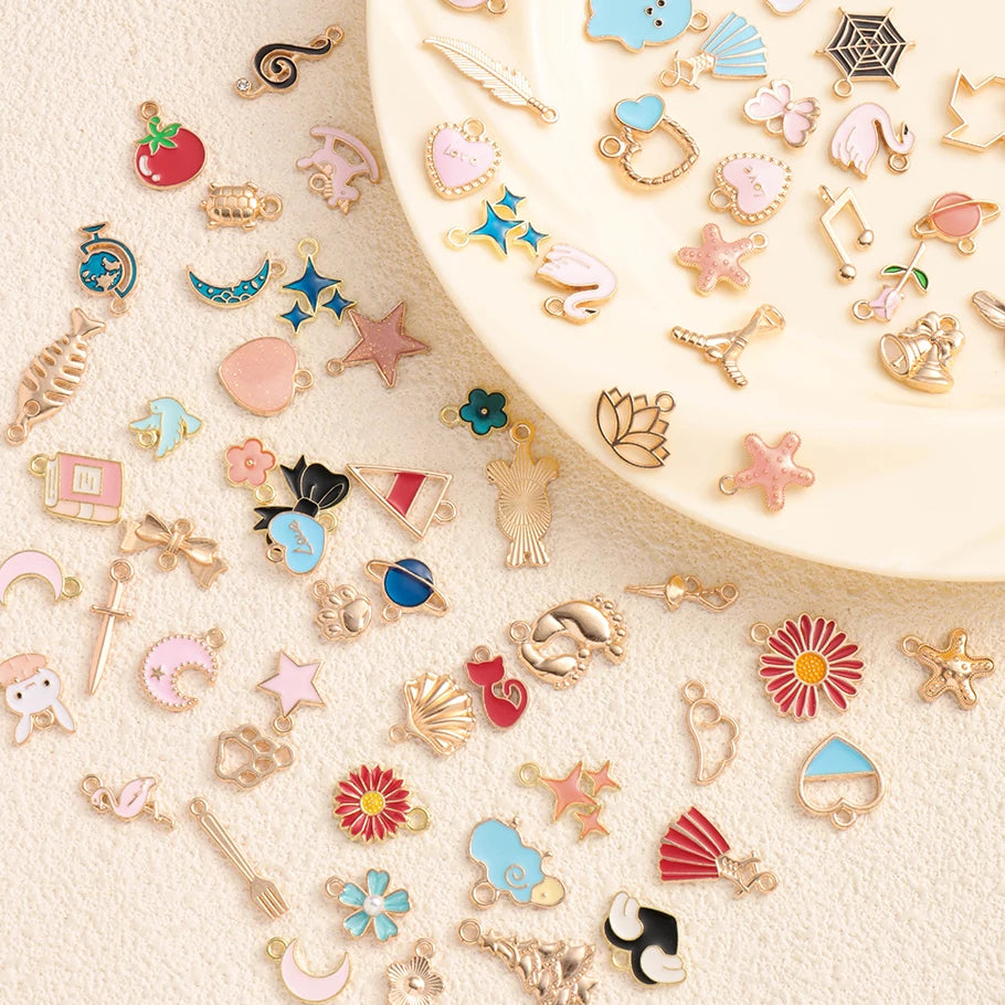 Assorted metal pendants and charms for jewelry making displayed on a light background.