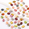 A collection of colorful Czech glass coffee bean beads for jewelry making, displayed on a white background.