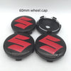 Two black wheel caps with red Suzuki logos shown on a white background.