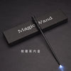 A black magic wand with a glowing blue tip is displayed on a dark surface.