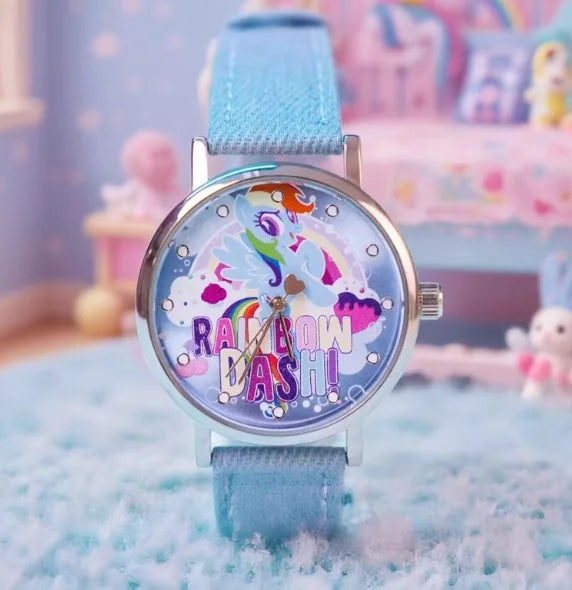 A colorful blind box watch featuring a rainbow design on a blue strap, displayed on a light blue surface.