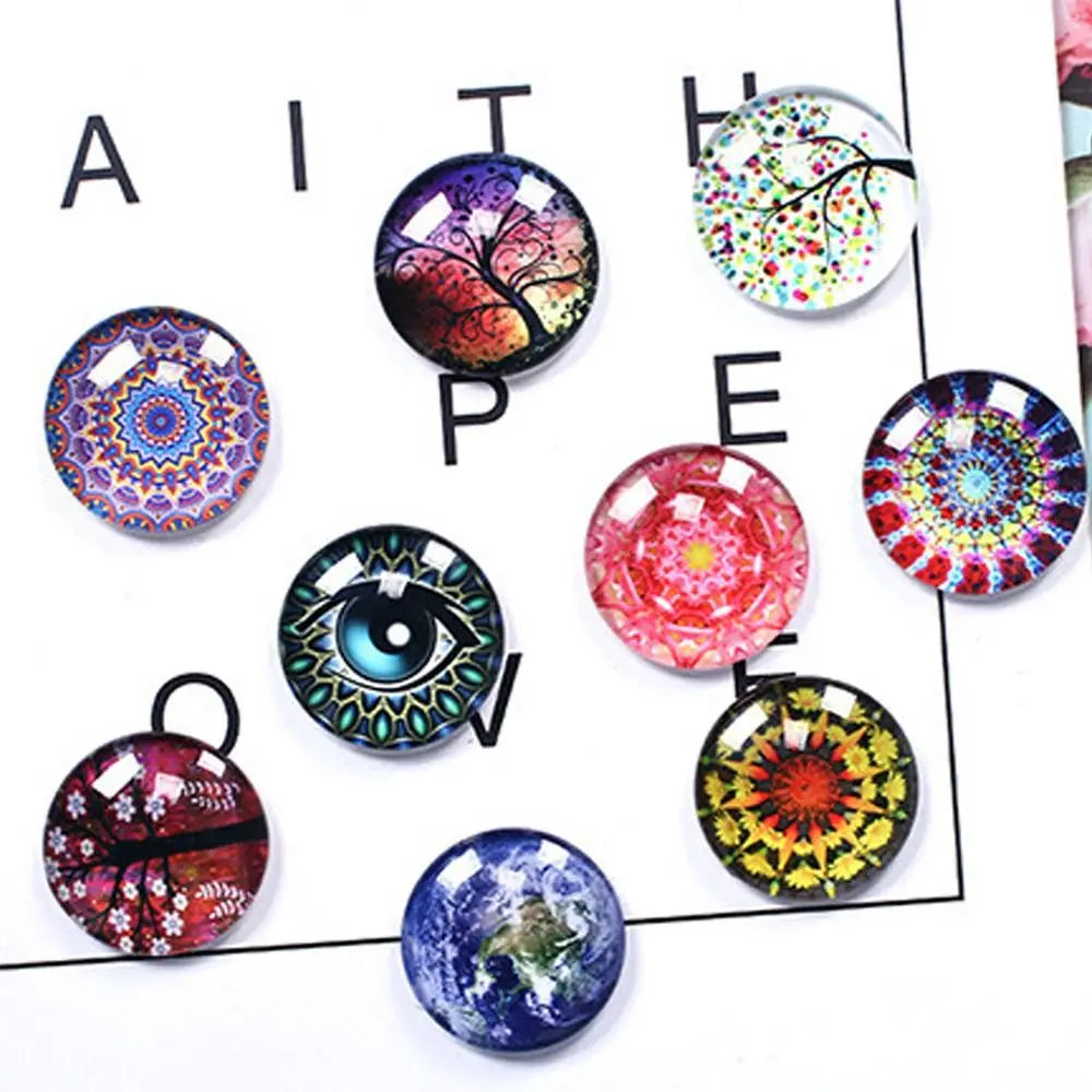 Assorted craft doll eyes with glitter finish in various colors and designs arranged on a white background.