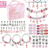 A box containing a pink charm bracelet and necklace making kit with various charms and tools.