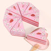 Pink layered cake shaped paper gift boxes with white floral dots and pink stripes