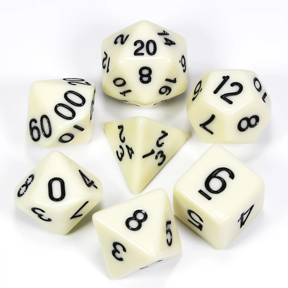 A collection of white acrylic dice showing various numbers and shapes for tabletop role-playing games
