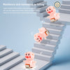 Pink piggy-shaped toy designed to be resilient and resistant to falling while climbing stairs.