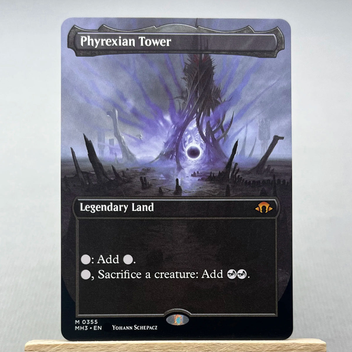 A Magic: The Gathering card featuring the Phyrexian Tower Legendary Land card.