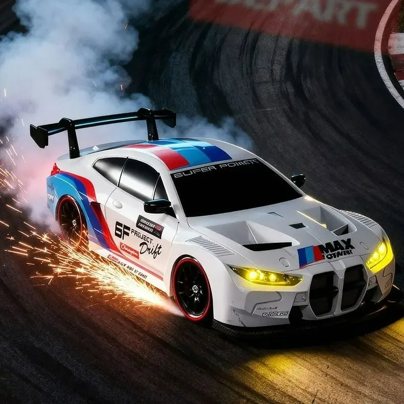 A white 4WD RC drift car with blue and red accents is speeding on a track, emitting bright light trails.