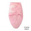 Pink cotton newborn swaddle blanket and hat set with a visible fabric detail