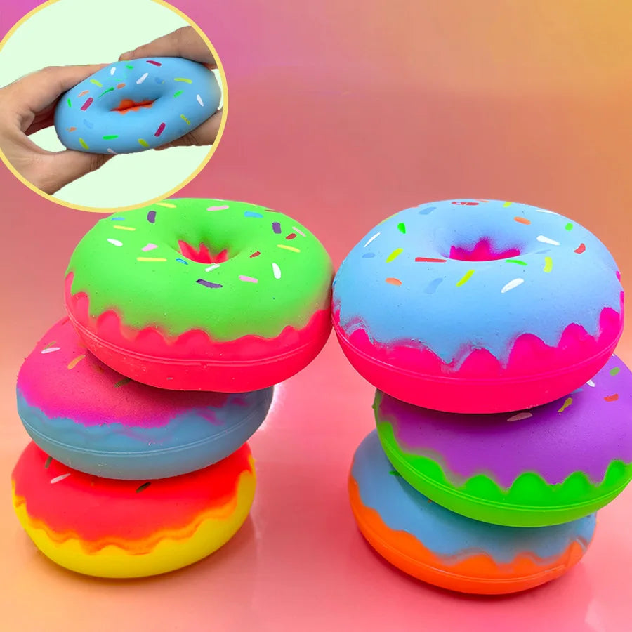 Colorful plastic donut squeeze toys in various bright colors like pink green blue and yellow