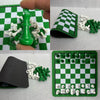 A green chess piece is shown next to a foldable rubber board and small white and green chess pieces.