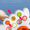 A white sensory toy with raised and concave buttons, demonstrating texture and flexibility for babies.