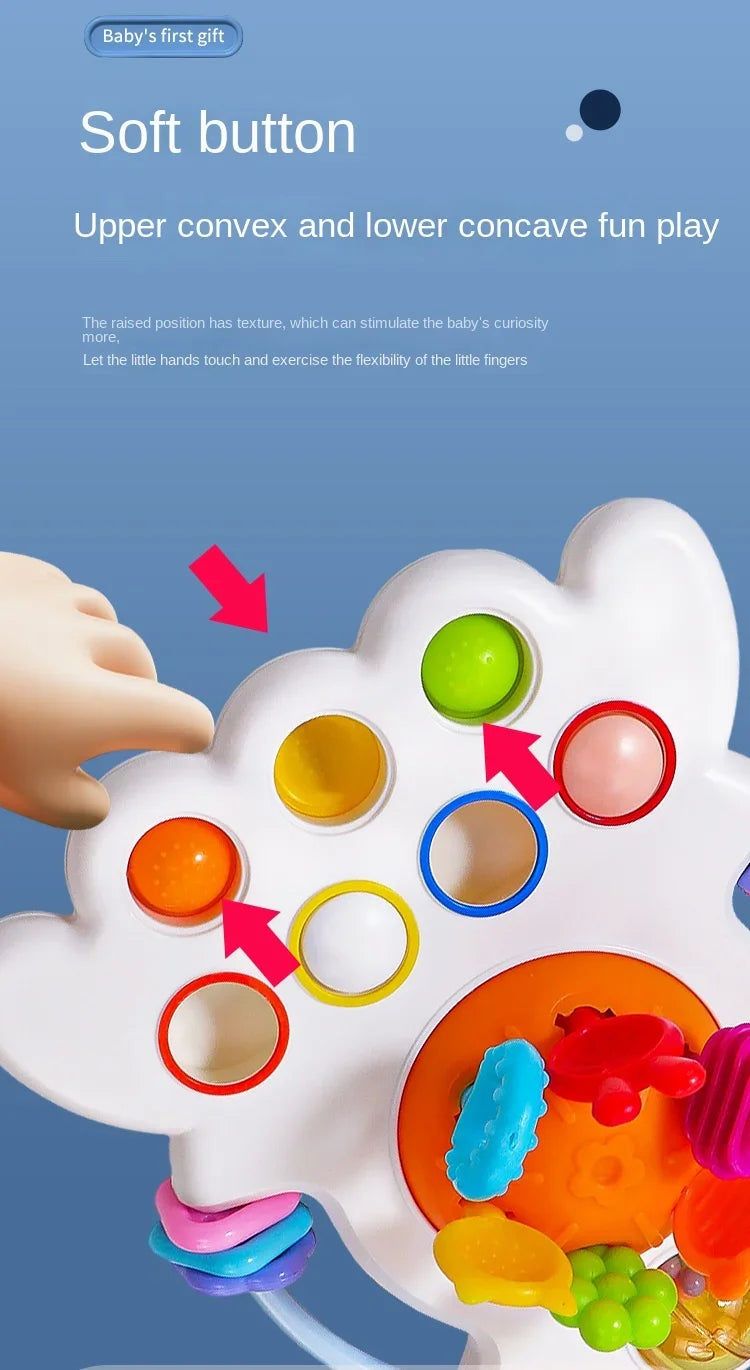 A white sensory toy with raised and concave buttons, demonstrating texture and flexibility for babies.
