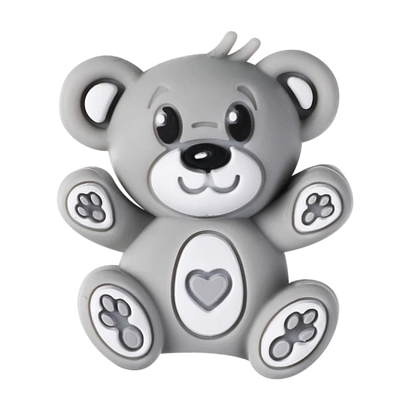 A gray silicone bear charm with a heart design, used as a focal bead for DIY jewelry making.