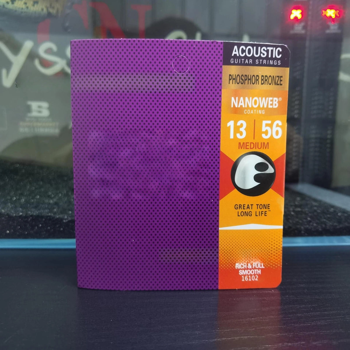 A box of Acoustic Guitar Strings in phosphor bronze coating with a medium gauge set labeled for great tone long life