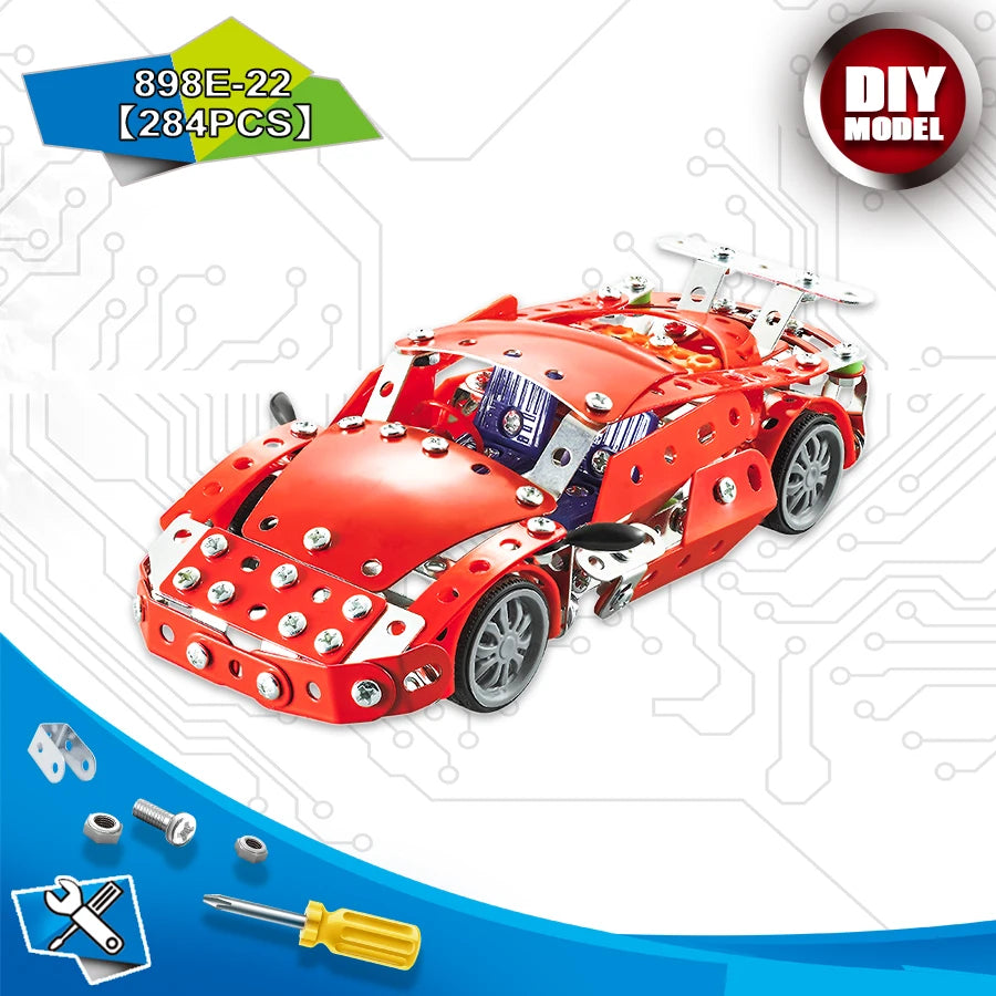 A red metal engineering vehicle building kit with various tools and parts shown in a close-up view.