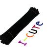A black tube of chenille stem craft pipe cleaners with a pink thread visible.