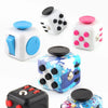 Various styles of decompression artifact fidget cubes in different colors and designs