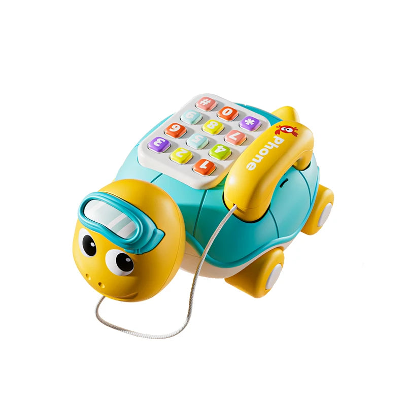 A yellow musical crawling turtle toy with a phone attachment for babies