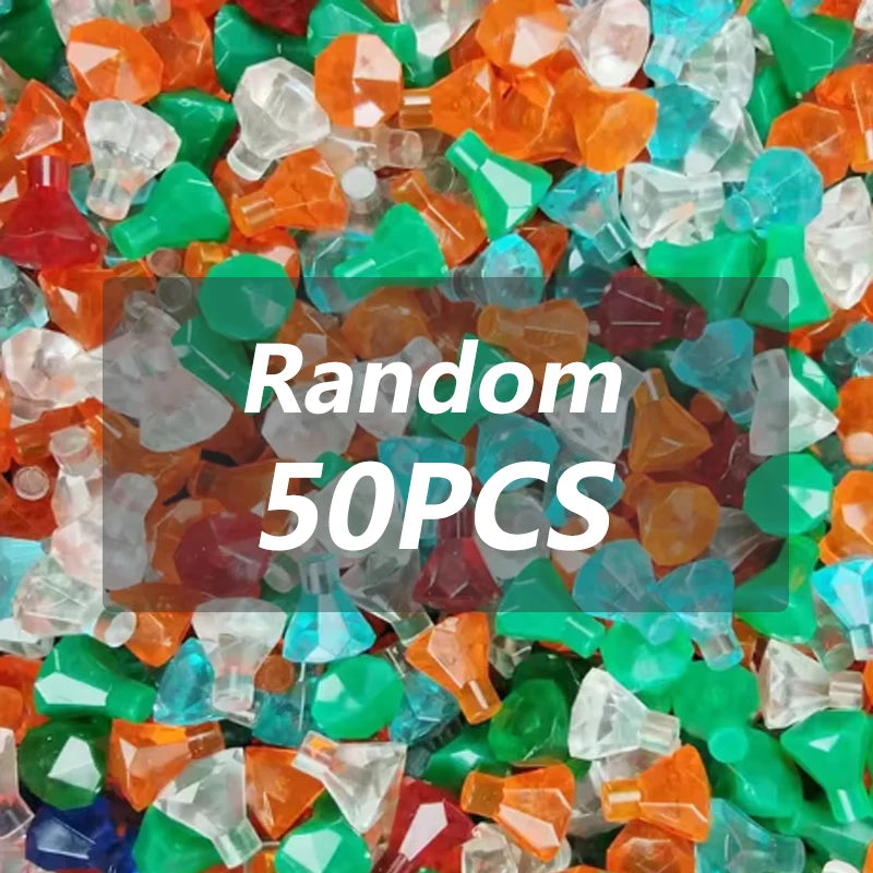 A pile of colorful, translucent building block treasure chest pieces in various shades of orange, green, and clear.