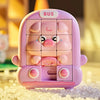 A pink animal slide puzzle for kids featuring a pig design, resting on a surface of small white beads.
