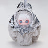 A silver-wrapped blind box plush doll with white hair and blue eyes, tied with a bow, hanging from a keyring.