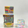 A box and a clear cube of holographic ribbon fidget toy for stress relief and sensory play.