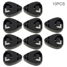 Ten black adhesive guitar pick holders for securing and storing guitar picks.