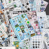 A collection of kawaii K-pop stickers and photocards featuring various themes, designs, and text for journaling and DIY craft