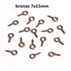 A collection of bronze eye pins with screw threads for jewelry making.