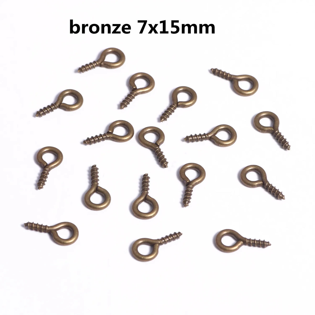 A collection of bronze eye pins with screw threads for jewelry making.
