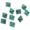 A set of ten green acrylic polyhedral dice showing various numbers and shapes.