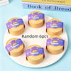Six round squishy dumplings with purple glitter packaging displayed on a white plate.
