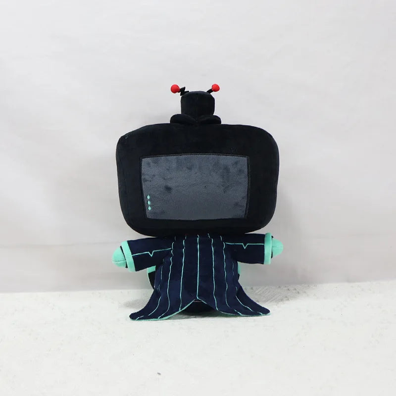 A black plush doll resembling a television set with red antennae and blue hands.