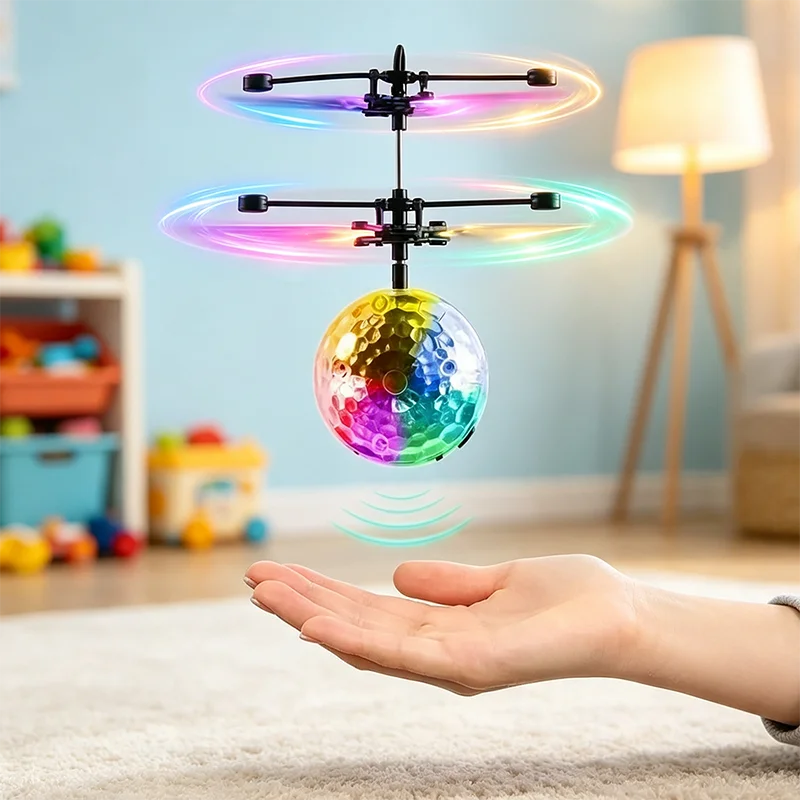 A hand holds a gesture-controlled levitating crystal ball with an LED light show above it.