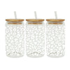 Three clear glass cups wrapped with leopard print UV DTF transfer stickers and cork lids