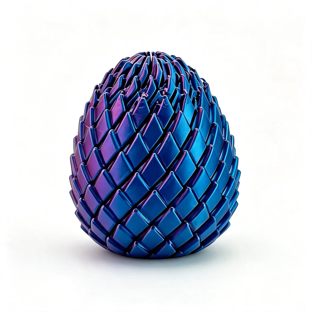 A close-up of a textured, iridescent blue dragon egg fidget spinner with a spiky surface.