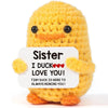Handmade crochet sunflower pot doll in yellow with a message that says Sister I duck love you