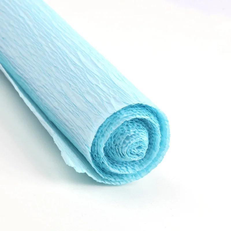 A roll of light blue crepe paper for DIY crafts and gift wrapping.