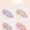 A variety of styles showing three newborn outfits for a baby doll.