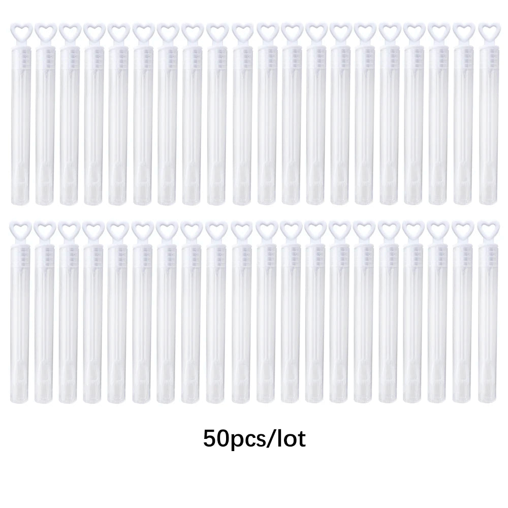 A large quantity of clear mini bubble wands packaged in a lot for party favors and celebrations