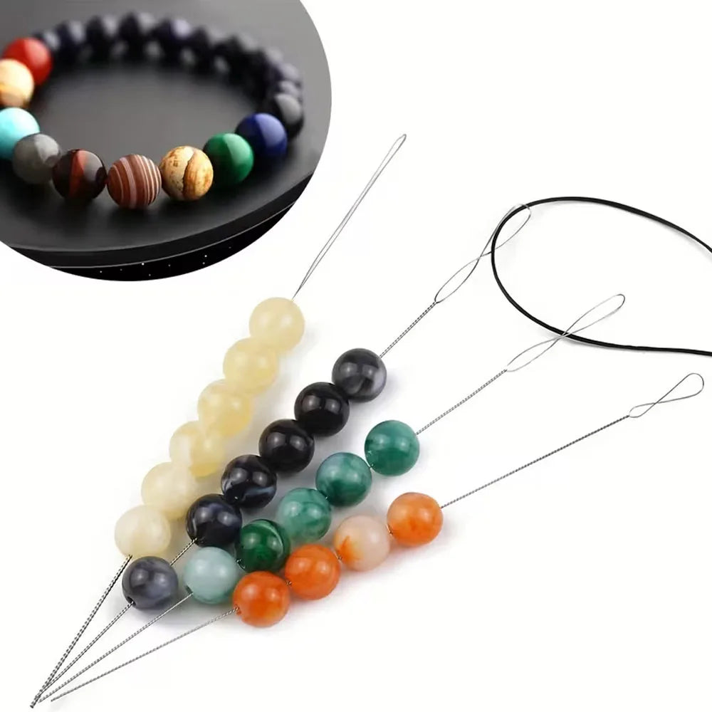 A set of seven flexible beading and threading needles with various colored beads for jewelry making
