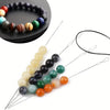 A set of seven flexible beading and threading needles with various colored beads for jewelry making