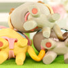A set of three pastel-colored vinyl cat figurines with pink scarf necklace accessories displayed on green moss.