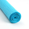 A roll of bright turquoise crepe paper for DIY crafts and gift wrapping.