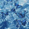 Blue butterfly paint by numbers kit on canvas floating in water