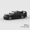 A black classic rally car building block set shown from the side.