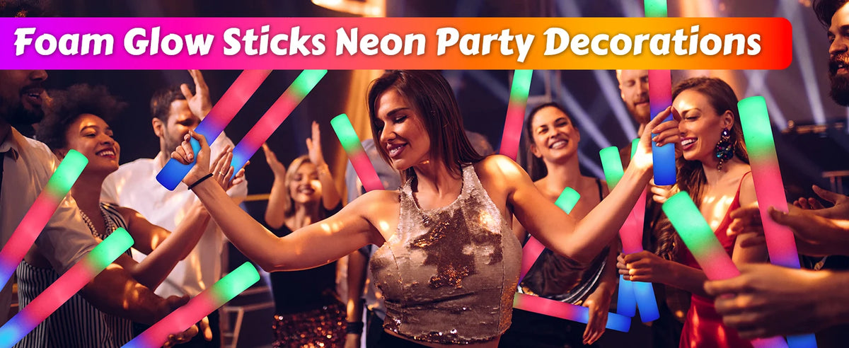 A woman is holding and using neon pink and green foam glow sticks in a party setting.