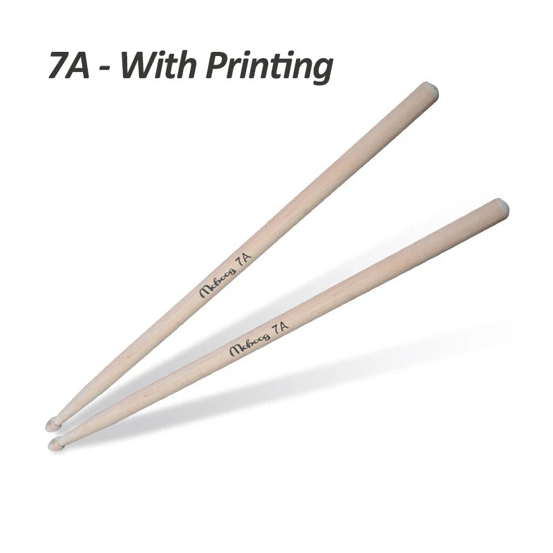A pair of light wood drumsticks with printing on the shaft.